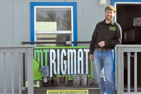 Travis Jordan, owner of MT Rigmats, stands outside his Charlo office. 
