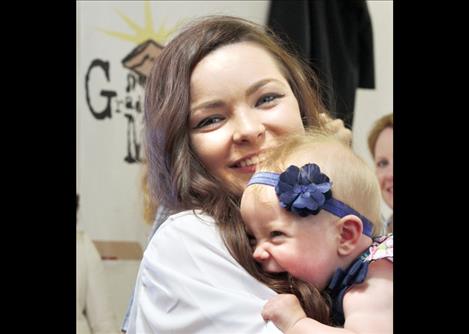 Salutatorian Amanda Andres gets a big hug from her daughter.