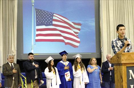 Nathan Doll sings  the National Anthem.