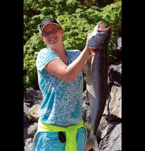 Jasmine Todd,17, shows off her 39 inch lake trout. 