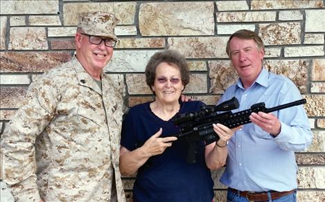 urelia Jackson of Polson won a Smith and Wesson AR15 rifle. Pictured with Jackson are Chuck Lewis of Standing for the Fallen, left, and Rob Shrider, owner of Ronan Sports and Western. Other winners below.