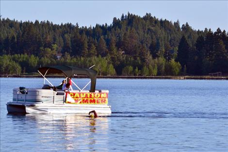 Mark Johnston attempts a bridge-to-bridge, 26-mile swim covering the length of Flathead Lake Sunday, June 21..