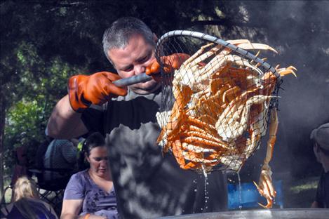 Dustin Clary lifts crab from a boiler. 