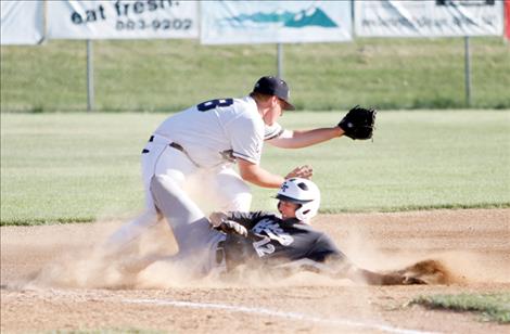 Mariner Russell Matt attempts to tag a Glacier player at third base.