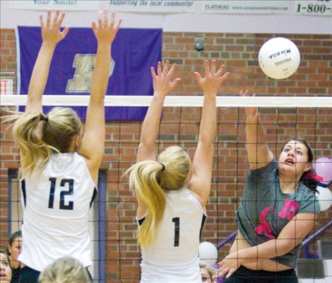 Chloie Huerta smacks the ball over the net during the Lady Pirates’ game against Frenchtown two weeks ago.