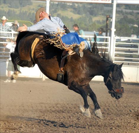 Danny Lien rides a bronc. 