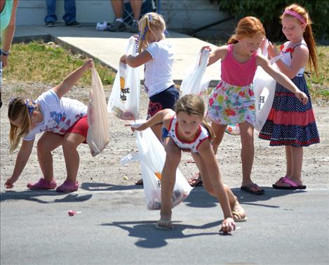 Friends scatter to pick up candy.