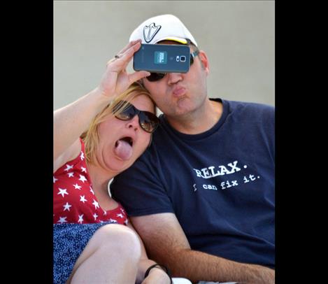 Kelly and Jeff Wilson of Portland snap a “selfie” before the parade, above.