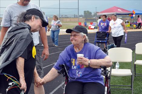 Louise Schock kills cancer with a beautiful smile and the help of a supportive friend. 