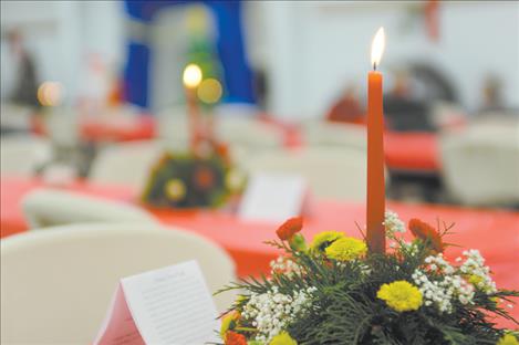 Jim Blow/Valley Journal Festive centerpieces donated by Bev's Bloomers added a joyful touch to each table at the community Christmas dinner.