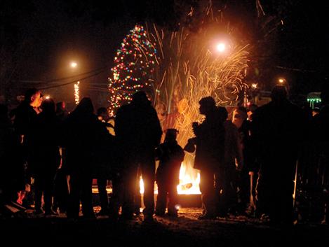 Sparks loft up from the bonfire held at Bockman Park after the Parade of Lights in Ronan.