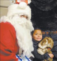 Ronan fire crews escort Santa on special delivery