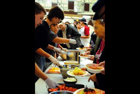 Attendees at a Democrat rally feast on Indian tacos and pumpkin pie before hearing candidates who were on a three-day trip to all Montana’s Indian reservations. 