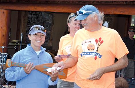 Cara Harrop accepts her prize for worst hand from Lakers President Greg McCormick.