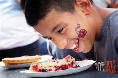 Oscar Roque prepares to dive in during the cherry pie eating contest held Sunday at Polson’s Flathead Cherry Festival