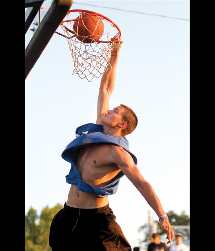 Connor Woodill scores on his way to winning $1,000 in Saturday night’s slam dunk  competition.