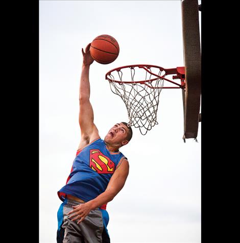 Nothing but net...MacKenzie Holt shows off his dunking skills during Saturday evening’s slam dunk contest.  