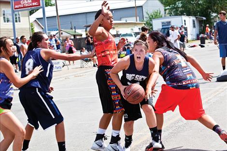 A Big Sky player looks for help from a teammate in an 11th-12th-grade girls’ game