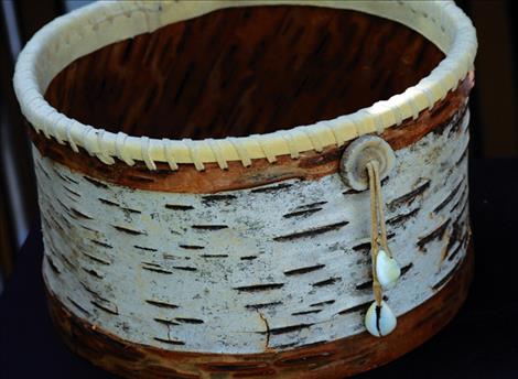 Artist Dion Albert brings birchbark creations to the Sandipiper show.