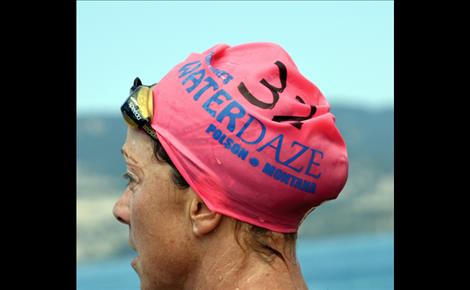 ue Hughes, Missoula, watches as other swimmers finish.