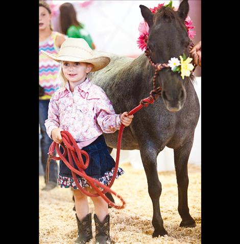 Eden Mitchell practices her showmanship in the Lake County Fair Small Fry Stock Show. 