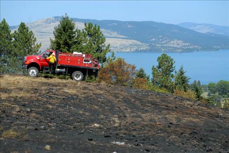 A crew from the Confederated Salish and Kootenai Division of Fire put 1,500 gallons of water on the burn the morning after.