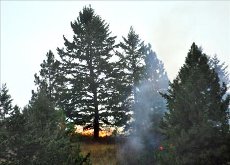 A lightning-caused fire flared up west of Polson hill Monday evening.