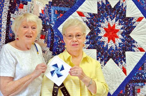 Bonnie Huber and LaVon Grandy are shown with the award-winning quilt. 