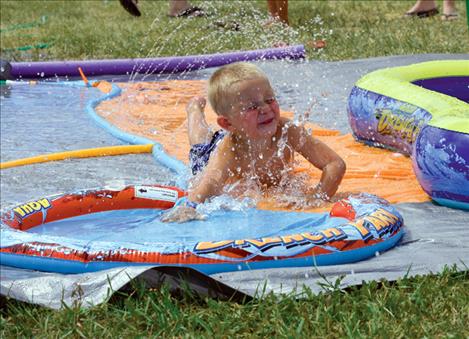 Rowdy Mills enjoys the Slip’N Slide at the Lake County Search and Rescue Fundraiser, part of Summerfest.