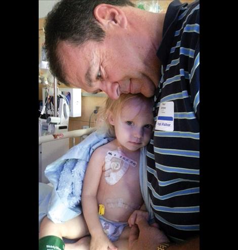  Little Thelma Mae gets hugs from her grandpa, Paul Briney.