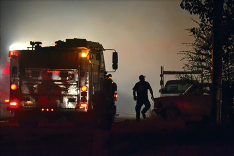 Lights on smoke pouring from a multiple trailer fire in Pablo lit up the community shortly after midnight Monday morning, displacing one family.