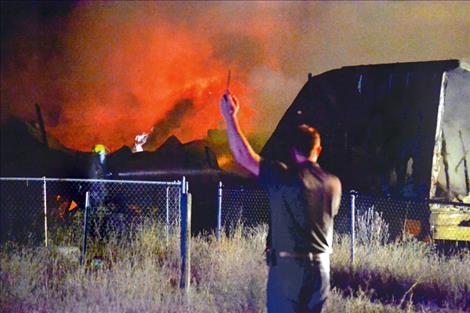 Fireworks ignite in a Pablo garage early Monday morning as responders  fight the blaze.