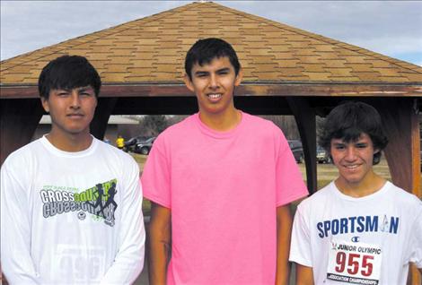 Donovan McDonald, Wyatt Mad Plume and Paden Alexander pose for a photo just before the Junior Olympic race. All three qualified for the national competition next month.