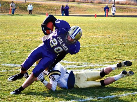 Pirate Will Davey eludes the grasp of a Dillon Beaver defender.