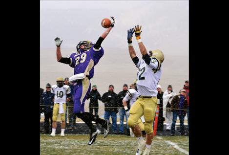 Cedrick Smith reaches for a pass in the first quarter of Saturday’s semifinal playoff game against Dillon, hosted by the Polson Pirates.