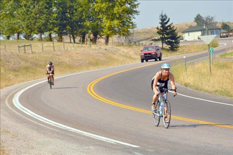 A biker rolls back toward town in the Polson Triathlon. 