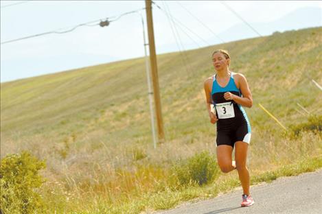 Erika Ackerlund closes her eyes and breathes during a leg of the Polson Triathlon. 