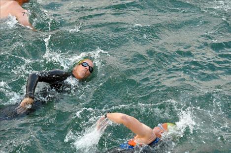 Swimmers settle into patterns of strokes and breaths during the swimming portion of the race.