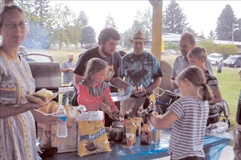 Families chow down at Ronan Library’s summer reading party. 