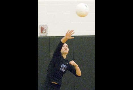 Libero Emyli Gillingham fires off a serve during divisional tournament play two weeks ago.