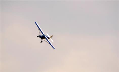 A radio-controlled airplane takes flight.