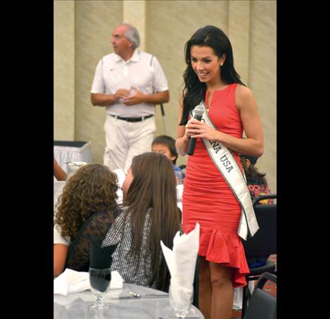 Peppenger answers a young girl’s question during the Big 3 Sports Clinic meet and greet dinner at KwaTaqNuk Resort in Polson.