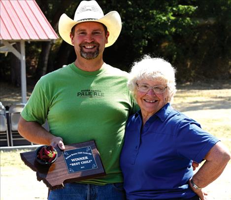 Chuck Wall, left, won first place for his chilii. He represented the Mission Valley Ice Arena.   The People’s Choice award went to the United Methodist Church’s “Trinity Chili.”