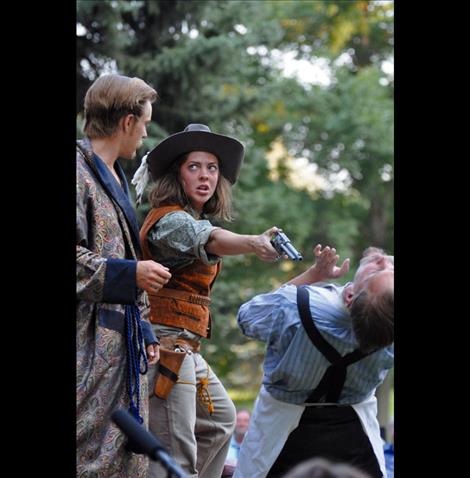 A man is held at gunpoint by Grumia during a performance of the Taming of the Shrew held in Palmer Park.