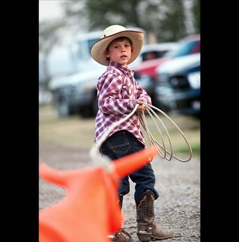 Liam John of LIvingston  practices roping a dummy steer