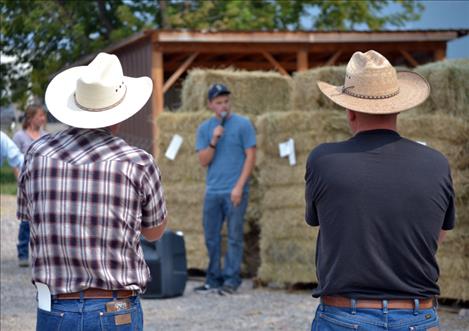 Auctioneer Travis Jeppesen keeps an eye on the subtle head nods of bidders.