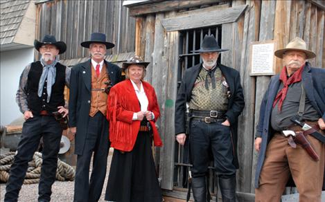 H.B. Whidden, Kent Ritz, Diane Kaechele, Charley Martin and Gary Riecke seem right at home in front of the jail at the Miracle of America Museum. They all belong to the Single Action Shooting Society.