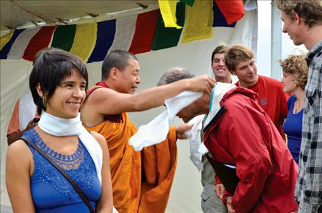 Namchag Khenpo presents choir members with scarves as a traditional gift of appreciation. 