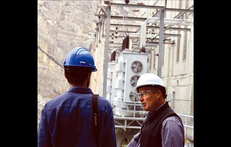 Brian Lipscomb, Energy Keepers, Inc.,  president and chief operating officer, answers questions outside the main Kerr  Dam building.