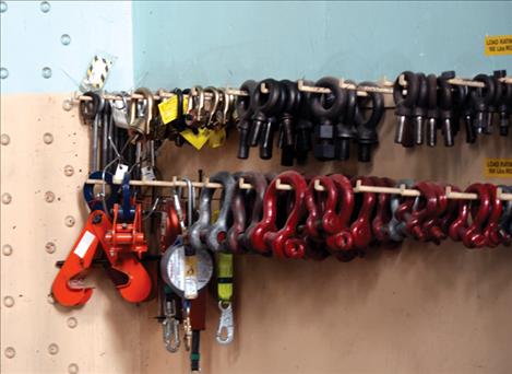 Come alongs, u-bolts and other pieces of hardware hang neatly in the dam works.  